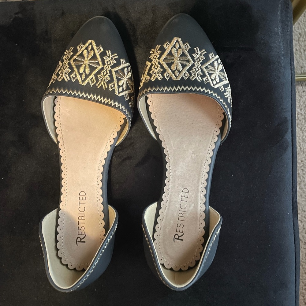 Black and gold dress shoes